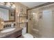 Bathroom features vanity with granite countertop, a toilet, and a tiled glass-enclosed shower at 5837 E Presidio Rd, Scottsdale, AZ 85254