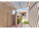 Exterior courtyard featuring a pergola and desert landscaping at 5837 E Presidio Rd, Scottsdale, AZ 85254