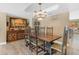 Elegant dining room features stylish lighting and a custom wood table for Gathering gatherings at 5837 E Presidio Rd, Scottsdale, AZ 85254