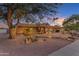 Lovely home featuring desert landscaping, stone accents, and a warm, inviting entrance at 5837 E Presidio Rd, Scottsdale, AZ 85254