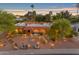 Charming single-story home with desert landscaping and a welcoming entrance at twilight at 5837 E Presidio Rd, Scottsdale, AZ 85254