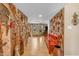 Bright hallway featuring decorative art, tile flooring, and a view into adjacent living spaces at 5837 E Presidio Rd, Scottsdale, AZ 85254