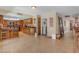Spacious kitchen shows tiled floors, granite countertops, wood cabinets, and opens to the living room at 5837 E Presidio Rd, Scottsdale, AZ 85254