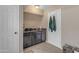 A cozy kitchenette with dark cabinets and sink, perfect for small meal preparation at 5837 E Presidio Rd, Scottsdale, AZ 85254