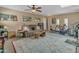 Spacious living room with a comfortable couch, area rug, and skylight at 5837 E Presidio Rd, Scottsdale, AZ 85254