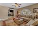 Bright living room featuring a large arched window, comfortable seating, and a welcoming ambiance at 5837 E Presidio Rd, Scottsdale, AZ 85254