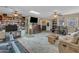 Spacious living room with a neutral paint, large bookcase and a television at 5837 E Presidio Rd, Scottsdale, AZ 85254