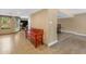 Inviting living space features tile flooring, a bright window, and a charming red bench at 5837 E Presidio Rd, Scottsdale, AZ 85254