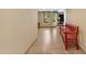 Inviting living space features tile flooring, a bright window, and a charming red bench at 5837 E Presidio Rd, Scottsdale, AZ 85254
