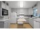Bright kitchen featuring gray cabinets, modern appliances, and a functional island at 6021 N 31St Ave, Phoenix, AZ 85017