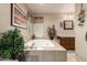 Bathroom featuring a relaxing soaking tub and neutral-toned tile at 6337 E Evergreen St, Mesa, AZ 85205