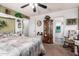 View of bedroom, with a ceiling fan and an ensuite bathroom at 6337 E Evergreen St, Mesa, AZ 85205