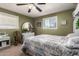 Comfortable bedroom featuring a ceiling fan, a neutral color scheme, and soft carpet at 6337 E Evergreen St, Mesa, AZ 85205