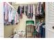 A walk-in closet with ample hanging space and built in shelving at 6337 E Evergreen St, Mesa, AZ 85205