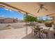 Covered patio with a dining set, perfect for outdoor entertaining at 6337 E Evergreen St, Mesa, AZ 85205