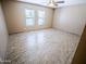 Neutral bedroom with a large window and tile floors at 6721 E Phelps Rd, Scottsdale, AZ 85254