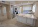 Bright kitchen featuring stainless steel appliances, granite countertops, and ample cabinet space at 6721 E Phelps Rd, Scottsdale, AZ 85254