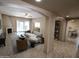 A spacious living room featuring a fireplace, open floor plan, and stylish modern decor at 6721 E Phelps Rd, Scottsdale, AZ 85254