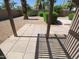 A private outdoor space featuring a tiled patio, desert landscaping, and pergola creating a relaxing backyard retreat at 6721 E Phelps Rd, Scottsdale, AZ 85254
