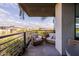 A relaxing balcony setting with cozy chairs and a view of trees and buildings at 7180 E Kierland Blvd # 316, Scottsdale, AZ 85254