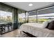 Sunlit bedroom with balcony access, showcasing outdoor views and a relaxing ambiance at 7180 E Kierland Blvd # 316, Scottsdale, AZ 85254