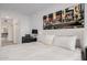 Beautifully decorated bedroom with a large bed, art, and access to the ensuite bathroom at 7180 E Kierland Blvd # 316, Scottsdale, AZ 85254