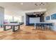 Spacious recreational area with pool table, bar seating, and golf simulator at 7180 E Kierland Blvd # 316, Scottsdale, AZ 85254