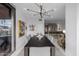 Bright dining room with modern light fixture, artwork, and an open layout that seamlessly connects to the kitchen at 7180 E Kierland Blvd # 316, Scottsdale, AZ 85254