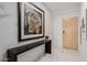 Hallway entrance featuring unique art and pristine marble floors at 7180 E Kierland Blvd # 316, Scottsdale, AZ 85254