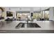Modern kitchen with stainless steel sink, stylish countertops, and a seamless transition into the adjacent living spaces at 7180 E Kierland Blvd # 316, Scottsdale, AZ 85254
