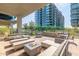 Outdoor patio area with a fire pit and seating, perfect for relaxing and entertaining at 7180 E Kierland Blvd # 316, Scottsdale, AZ 85254