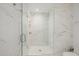 Sleek, glass-enclosed shower featuring marble-style tiles and a rainfall showerhead for a luxurious experience at 7180 E Kierland Blvd # 316, Scottsdale, AZ 85254