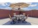 Backyard patio set under a sun umbrella at 7235 W Flower St, Phoenix, AZ 85033