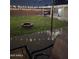 Backyard featuring a brick fire pit, grill, and decorative lights for outdoor entertaining at 7235 W Flower St, Phoenix, AZ 85033