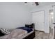 The bedroom features a closet, desk, and hardwood floors at 7235 W Flower St, Phoenix, AZ 85033