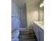 Bathroom featuring a walk-in shower, modern vanity, and updated fixtures at 8115 N 56Th Ave, Glendale, AZ 85302
