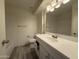 Updated bathroom featuring a tub, shower, and modern vanity with updated fixtures at 8115 N 56Th Ave, Glendale, AZ 85302
