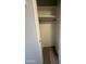 Cozy closet space with built-in shelves and a wooden rod for clothes at 8115 N 56Th Ave, Glendale, AZ 85302