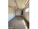 A well-lit garage offers ample space and includes essential utilities for convenience at 8115 N 56Th Ave, Glendale, AZ 85302
