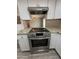 Close-up of the stainless steel oven and granite countertop in the kitchen at 8115 N 56Th Ave, Glendale, AZ 85302