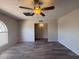Open living room with ceiling fan, new floors and direct access to other rooms at 8115 N 56Th Ave, Glendale, AZ 85302