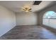 Bright living room with new floors, modern ceiling fan and large window with pleasant views at 8115 N 56Th Ave, Glendale, AZ 85302