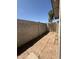 The side yard features a brick-paved pathway with a block wall and a gated entrance at 8115 N 56Th Ave, Glendale, AZ 85302