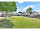 Spacious backyard with mature trees, a patio, and plenty of space to enjoy at 830 E Orchid Ln, Phoenix, AZ 85020