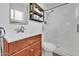 Bathroom with glass shower, sink with new vanity, and updated faucet at 830 E Orchid Ln, Phoenix, AZ 85020