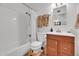 Modern bathroom featuring a tub, shower, and new vanity at 830 E Orchid Ln, Phoenix, AZ 85020