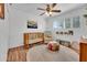 Comfortable bedroom with a crib, ceiling fan, and natural lighting at 830 E Orchid Ln, Phoenix, AZ 85020