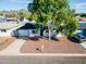 Charming home with a well-manicured yard, mature trees, and a welcoming curb appeal at 830 E Orchid Ln, Phoenix, AZ 85020
