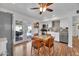 Well-lit kitchen with stainless appliances, cozy dining area, and easy access to the outdoor entertainment space at 830 E Orchid Ln, Phoenix, AZ 85020