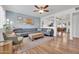 Open living area showcasing stylish decor, wood floors, and seamless flow into the dining space at 830 E Orchid Ln, Phoenix, AZ 85020